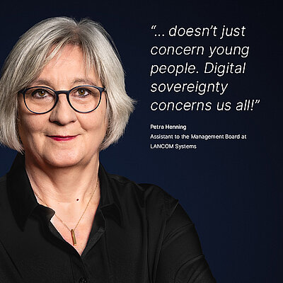 Image for the LANCOM campaign “Digital Sovereignty”: A white quote about what digital sovereignty means to a LANCOM employee is displayed on a dark blue background, with a portrait photo of the person next to it. The quote reads: “...doesn't just concern young people. Digital sovereignty concerns us all!” by Petra Henning, Assistant to the Management Board at LANCOM Systems. On the left is a portrait photo of Petra Henning, a friendly middle-aged woman with a warm smile, a gray bob haircut, black glasses, and red lipstick.