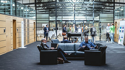 People in the entrance hall of a trade fair